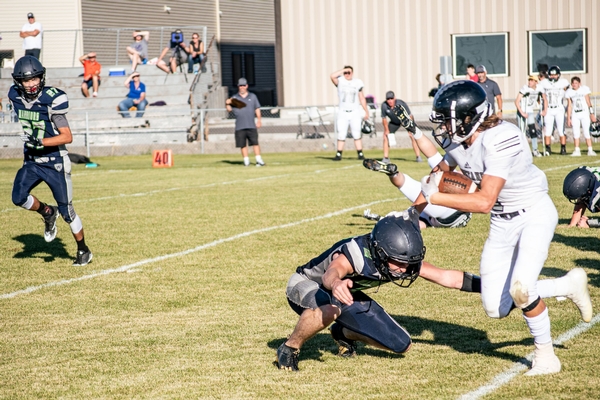 Football Player bracing for tackle.