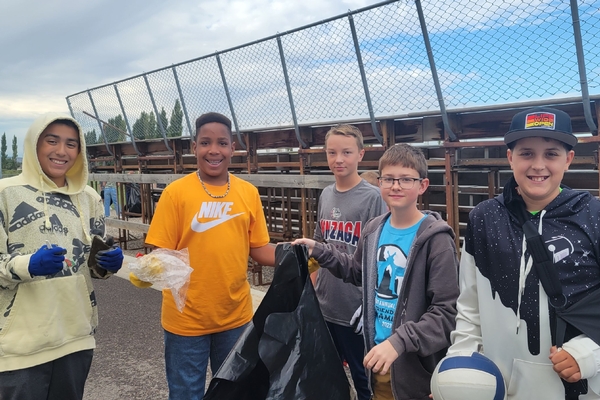 Middle School boys picking up garbage.